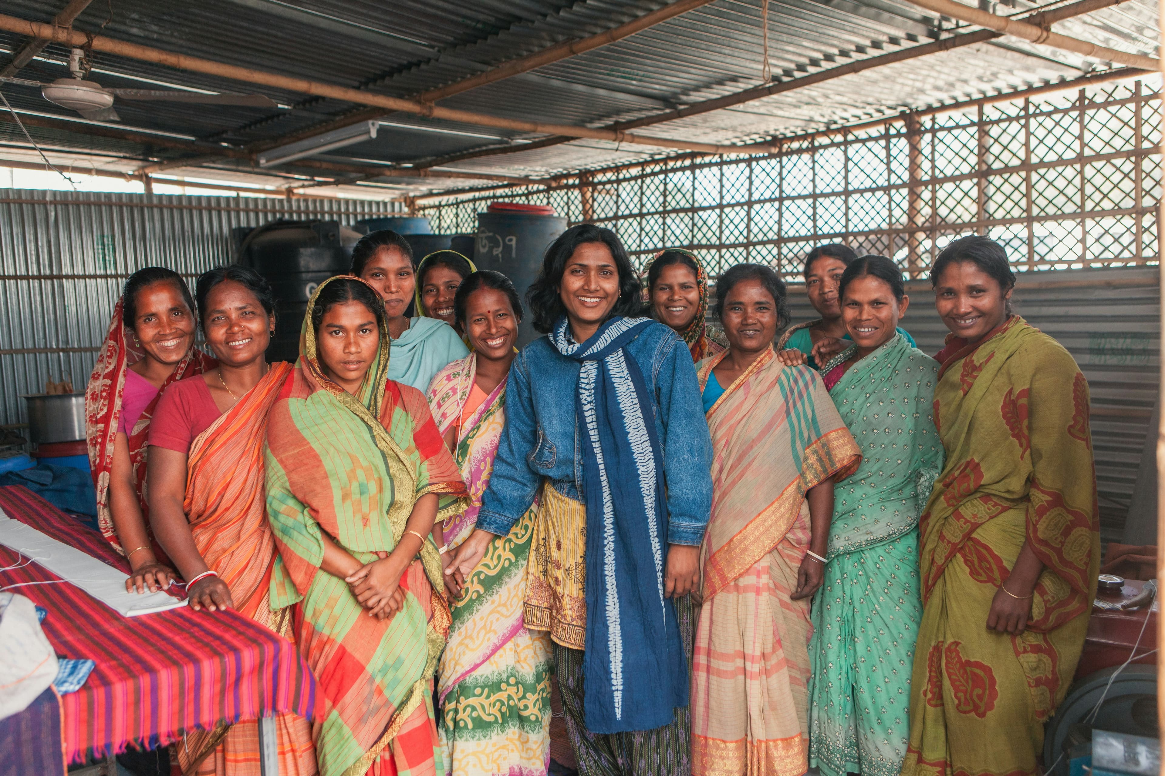 Women standing together at a community programme